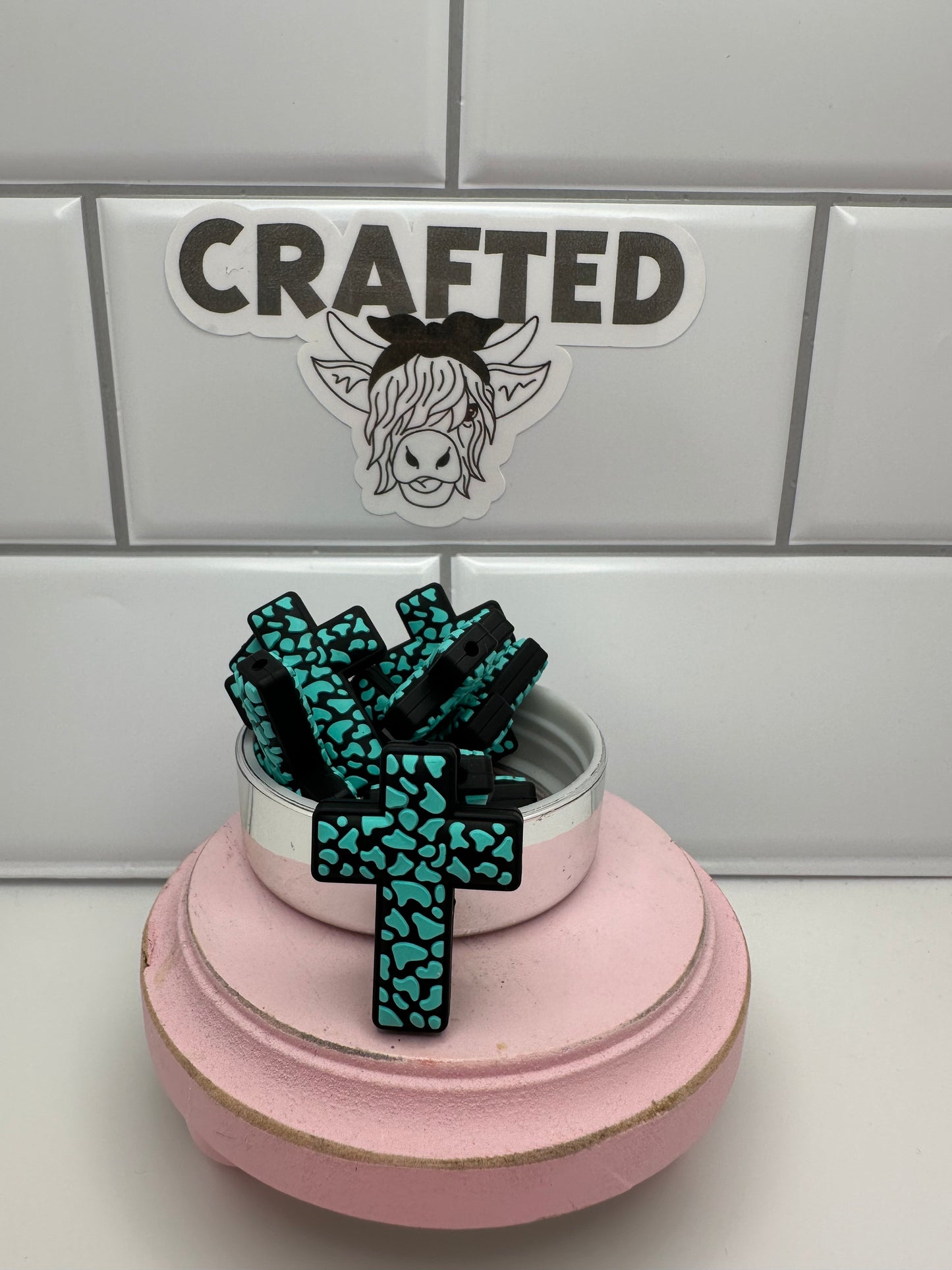 Teal and black cow print cross